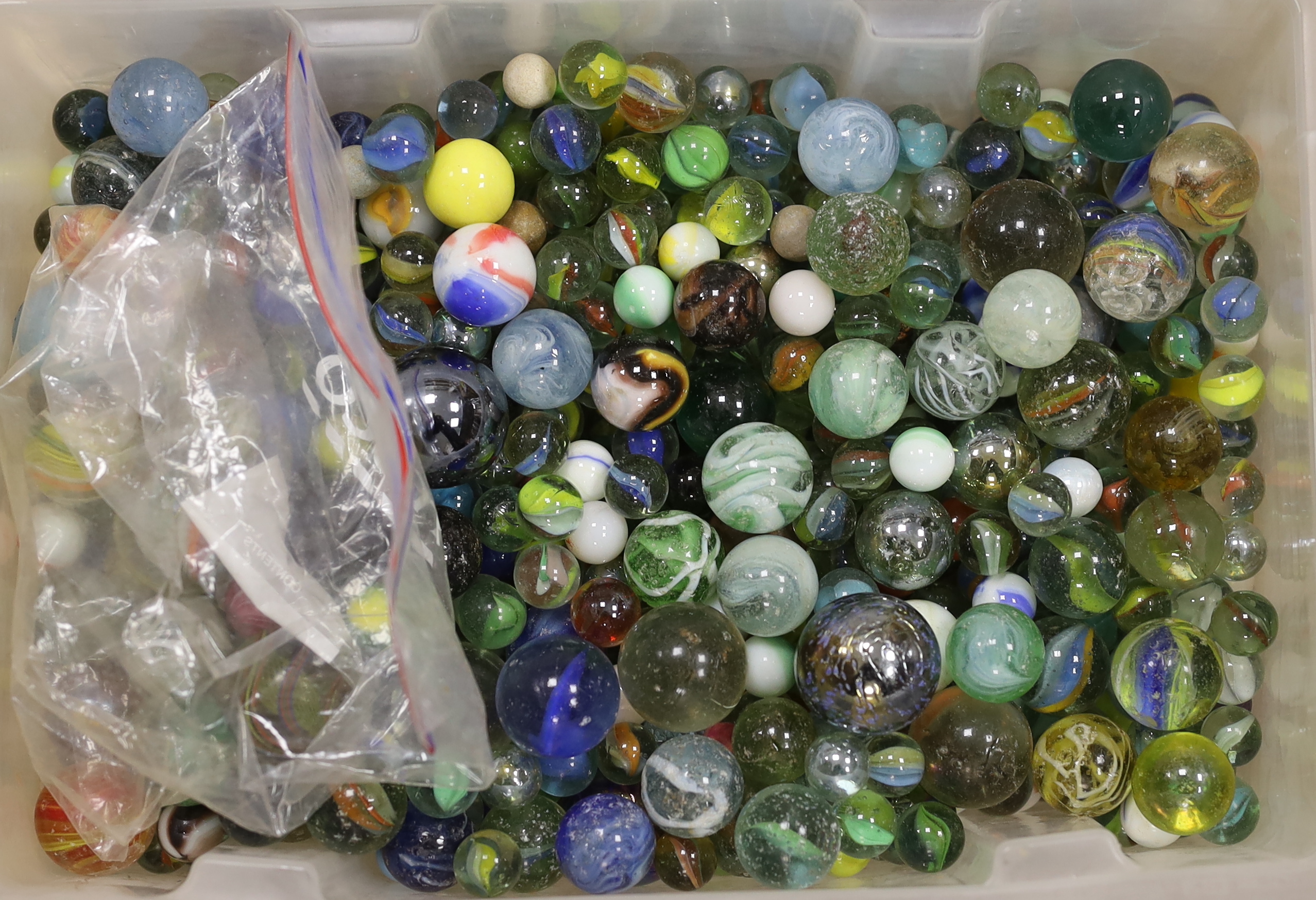 A large collection of glass marbles in two boxes